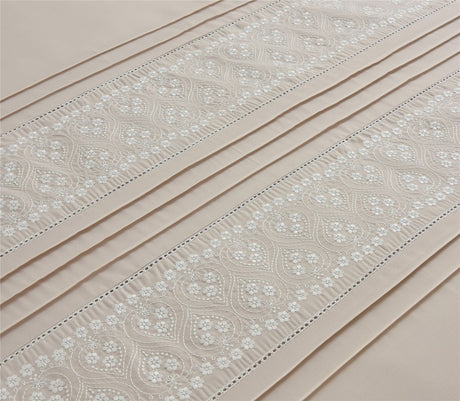Elegant Charlotte Duvet Set featuring refined floral embroidery and subtle pleated design on neutral bedding