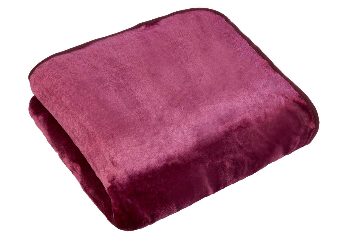 Luxurious dyed mink throw blanket featuring soft, plush fur in vibrant, rich color tones for cozy, elegant home decor