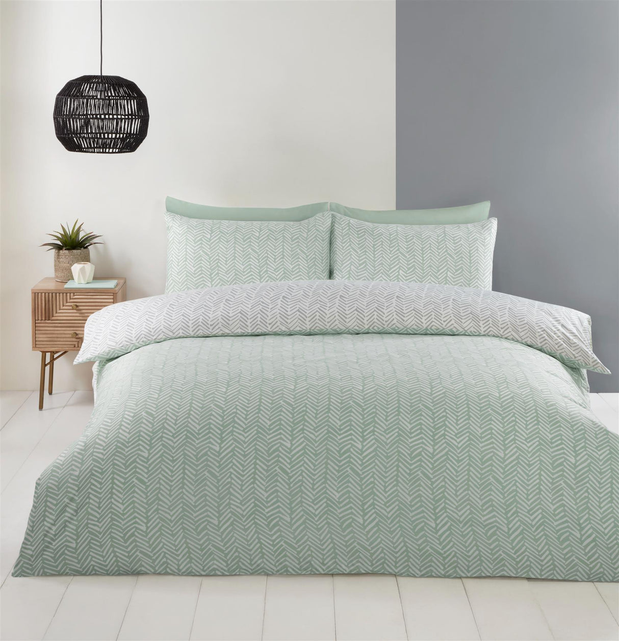 The Helston Duvet Set's microfibre fabric gently draped over a bed, emphasising its cosy and soft feel against the skin