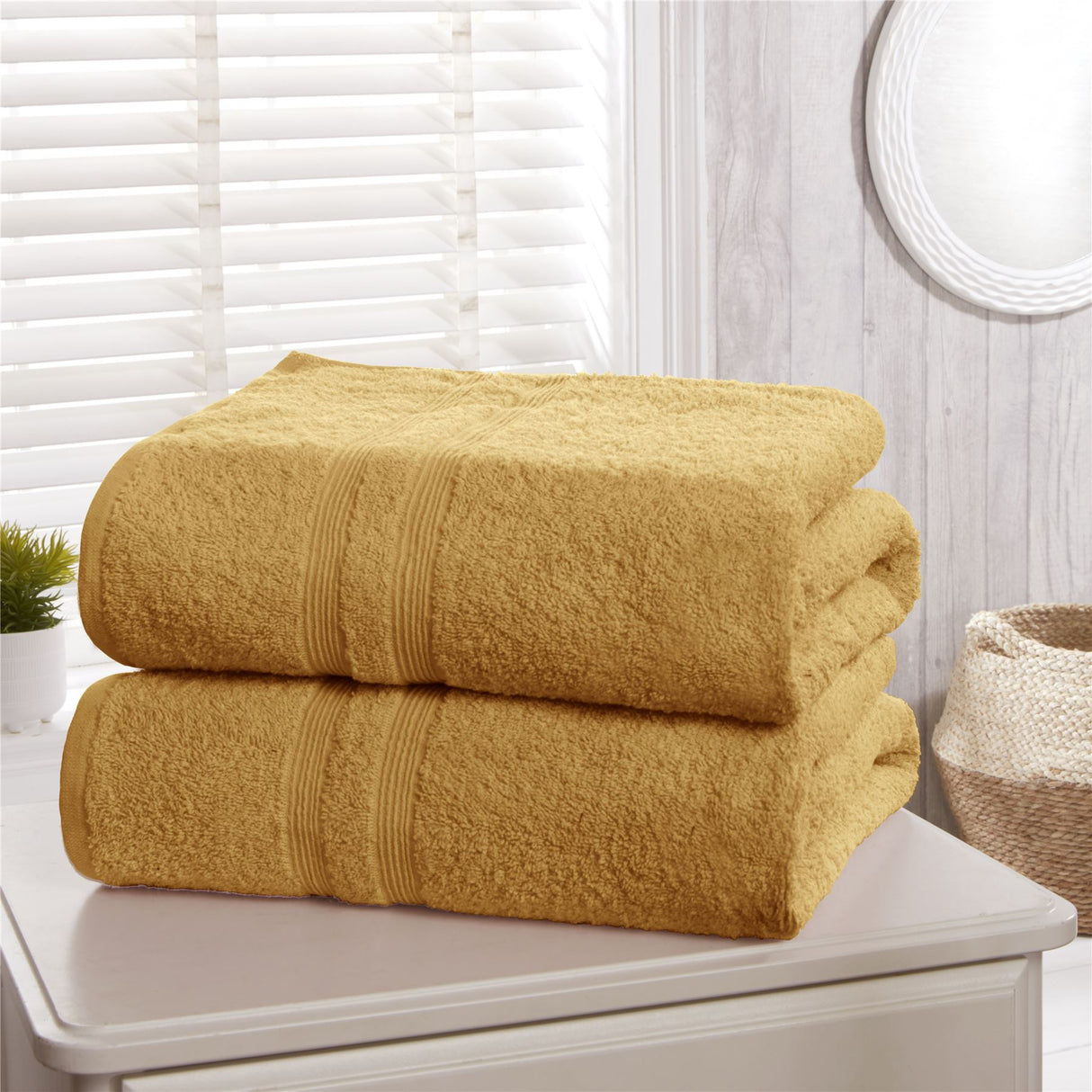 Set of Camden towels including face cloths, hand towels, bath towels, and bath sheets, all crafted from 100% pure combed cotton