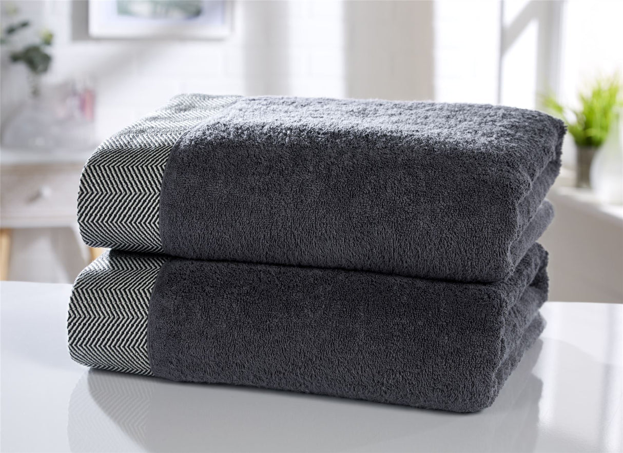 Luxurious tidal towel with herringbone border detailing in 100% cotton fabric
