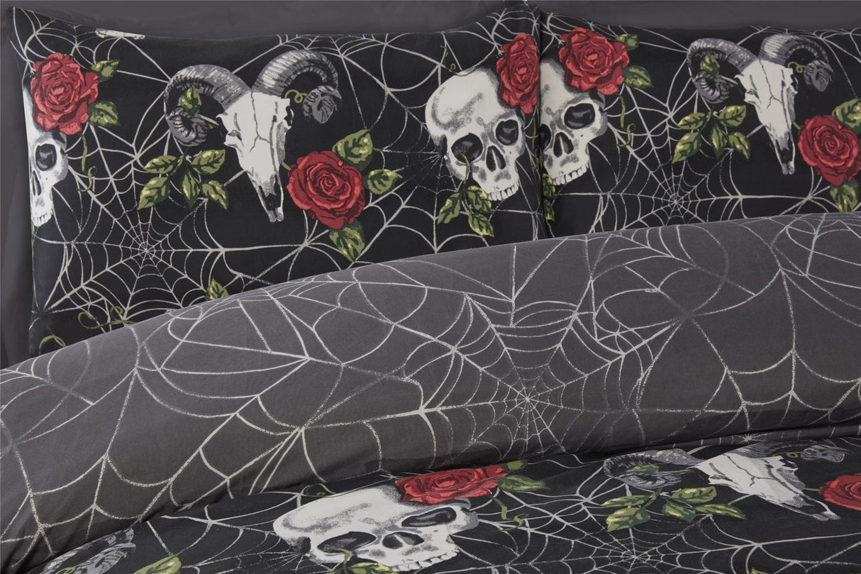 Darkly enchanting bedding with skull, rose, and web motifs for a Halloween-themed bedroom decor