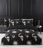 Enchanting Gothic-inspired bedding set featuring skull, sun, and moon motifs, fully reversible with easycare fabric for a mystical bedroom transformation