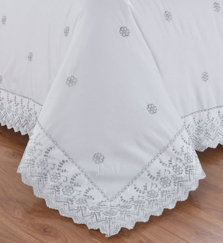 Serene bedroom scene showcasing the elegant Gabrielle Duvet Set with intricate embroidery and classic charm