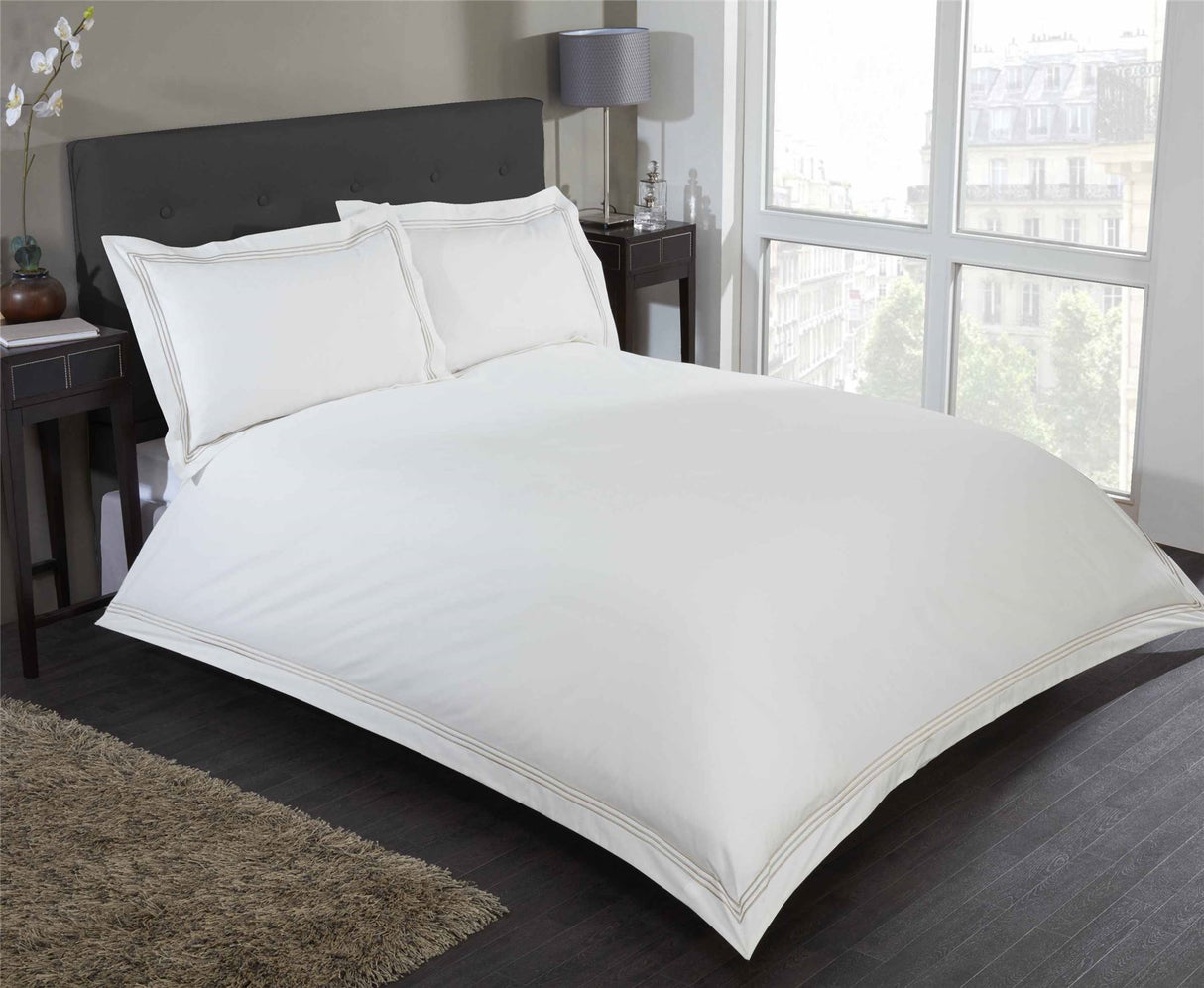 Elegant Mayfair Duvet Set showcasing modern minimalist style with embroidered rectangular border detail on duvet cover and matching pillowcases