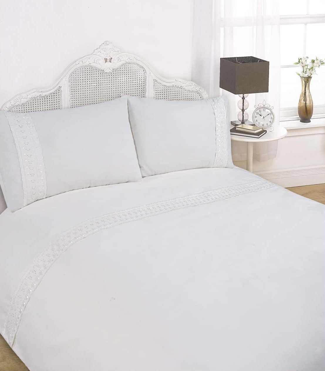 Beautifully designed Sorrento Duvet Set showcasing a simplistic style with intricate lace accents on duvet header and pillowcases