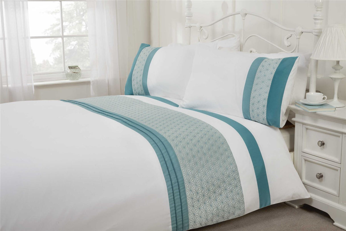 Detailed view of the Anise Duvet Set highlighting the sophisticated star quilted pattern and elegant satin pintuck finishing