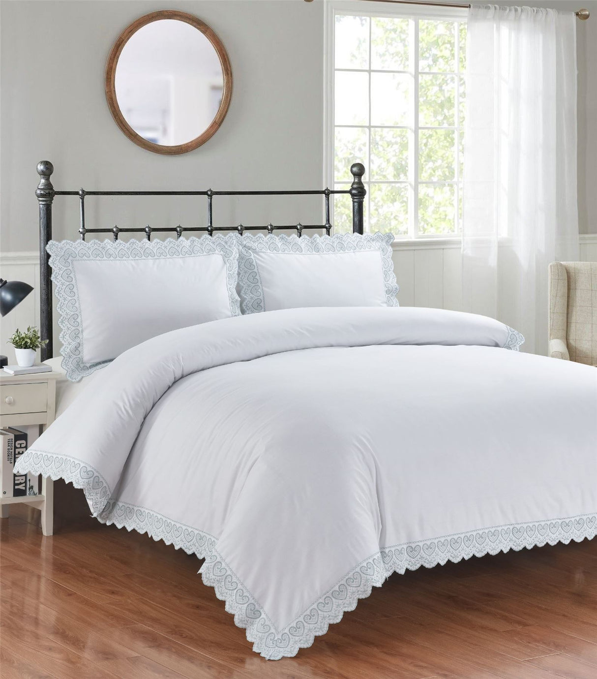 Elegant Elise Duvet Set featuring delicate heart-shaped embroidery and intricate lace edging on a soft bed linen