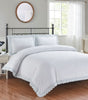 Elegant Elise Duvet Set featuring delicate heart-shaped embroidery and intricate lace edging on a soft bed linen