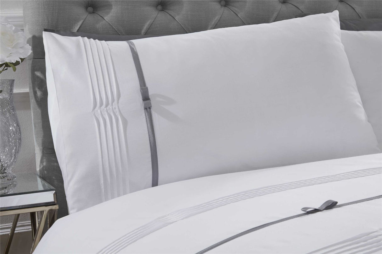 Elegant Clarissa duvet set with finely crafted pintuck detailing and contrasting ribbon bows