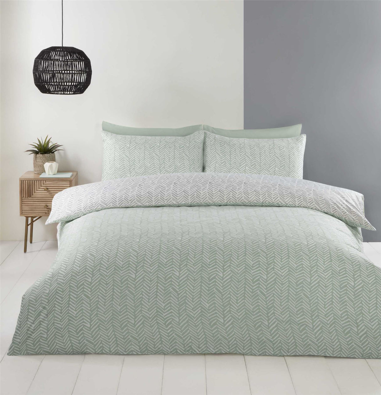 A bedroom scene showing the Helston Duvet Set styled with complementary bedding and modern decor