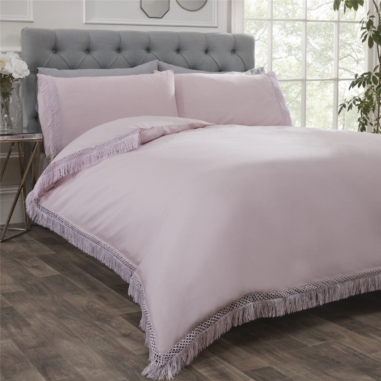 Elegant plain Tia Trellis duvet cover with contrasting lace fringe trim on the duvet and pillowcases