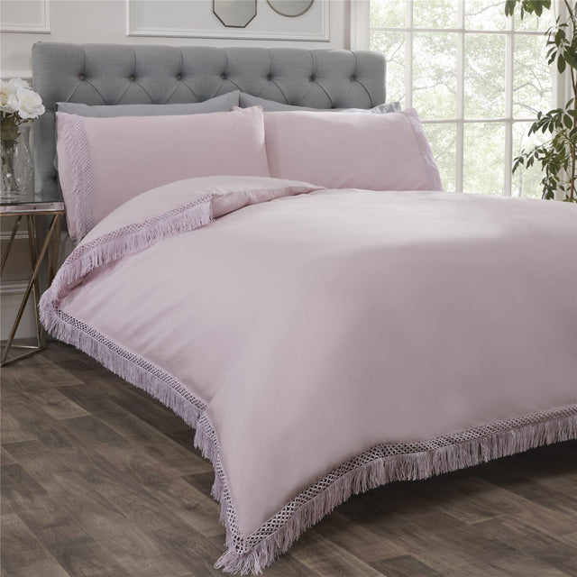 Elegant plain Tia Trellis duvet cover with contrasting lace fringe trim on the duvet and pillowcases