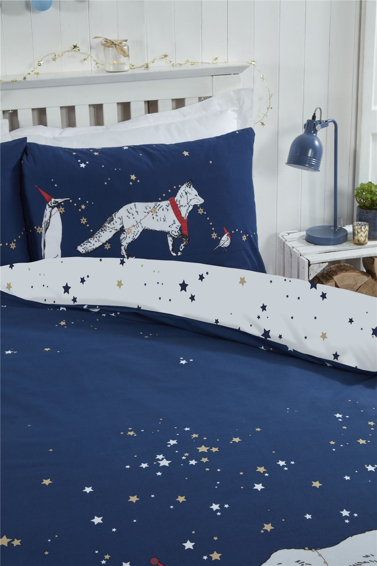 Close-up of the reversible Polar Bears & Friends Duvet Set showcasing a colourful animal parade on one side and a charming star pattern on the reverse, made from easycare fabric with a popper closure for simple use