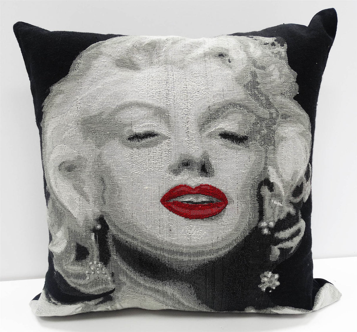 A heavyweight cushion featuring a Marilyn Monroe design measuring 43x43cm, adding Hollywood glamour to your home