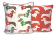 A colourful reversible cushion featuring a playful all-over sausage dog design, measuring 43x43cm, with a piped edge finish