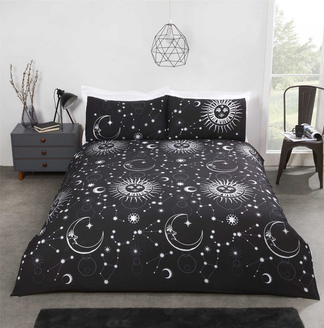 Celestial duvet set featuring metallic suns and moons on a dark background with reversible star design