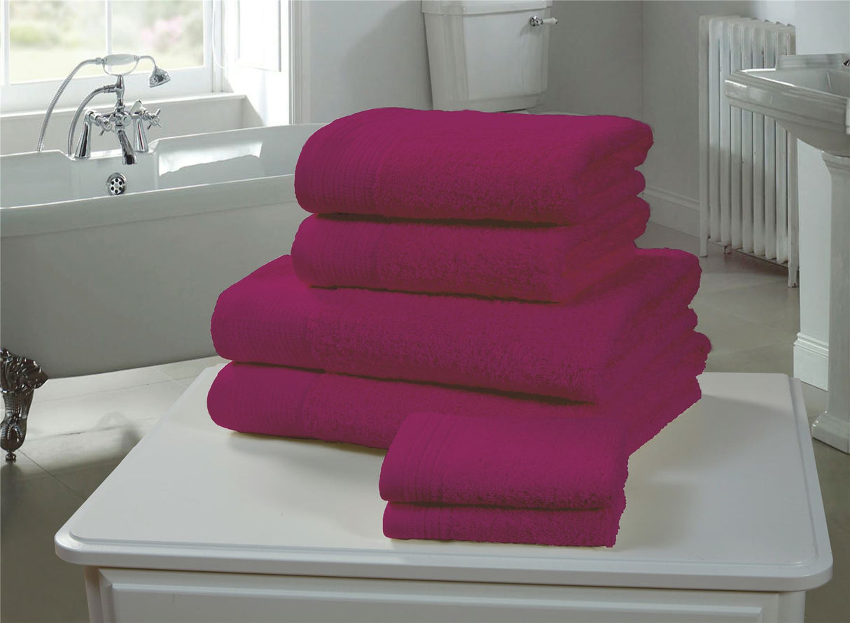 Close-up of a magenta face cloth highlighting its 600GSM, durable, and lofty cotton material for gentle skincare and drying