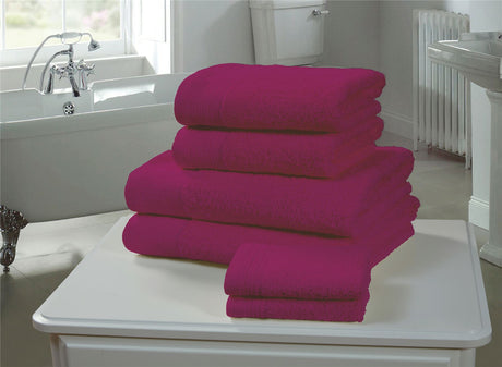 Close-up of a magenta face cloth highlighting its 600GSM, durable, and lofty cotton material for gentle skincare and drying