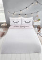 Brightly coloured duvet cover with eyelash and polka dot print, fully reversible design