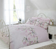 Elegant bedding with delicate floral and bird motif, includes matching pillowcases and popper closure