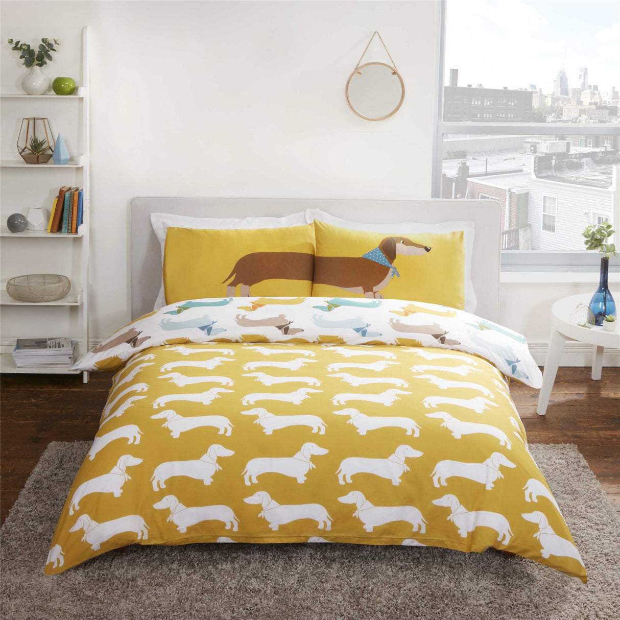 Single duvet set with colourful sausage dog print and coordinating pillowcase featuring a stretched sausage dog across the pillow