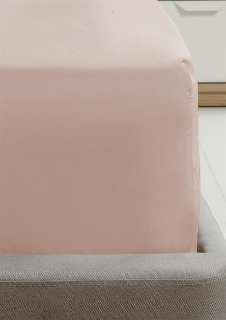 A close-up of the Happy Home Essentials 16-inch fitted sheet showcasing soft, high-quality fabric in a neutral color, perfectly fitted on a mattress for a comfortable, wrinkle-free sleep surface