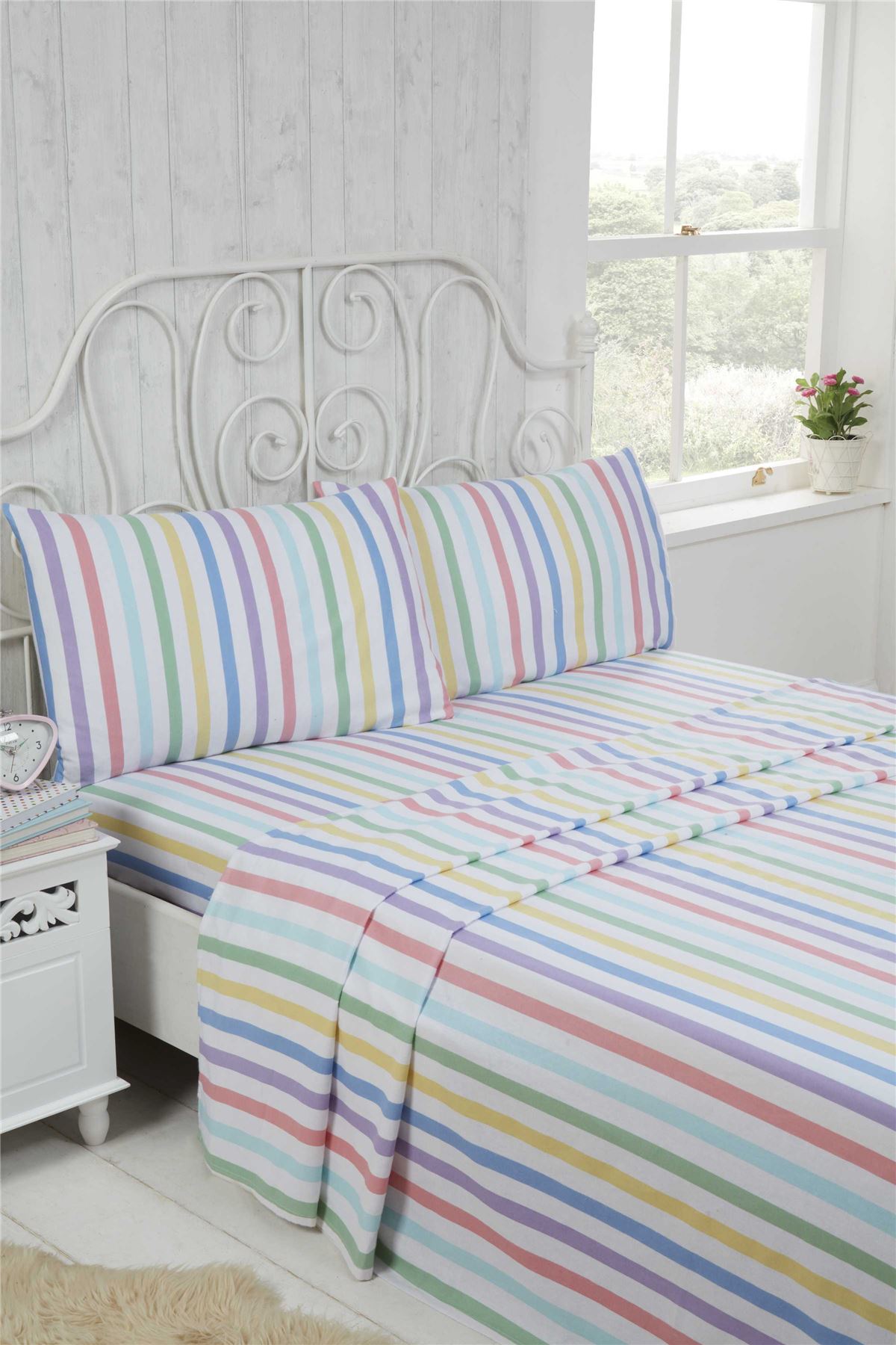 A cosy Candy Stripe Brushed Cotton Sheet Set featuring bright pastel shades, including a fitted sheet, flat sheet, and matching pillowcases, made from super soft 100% brushed cotton for comfortable winter nights