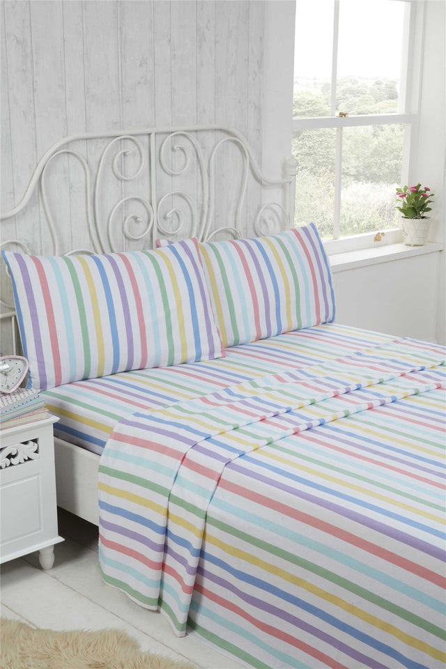 A cosy Candy Stripe Brushed Cotton Sheet Set featuring bright pastel shades, including a fitted sheet, flat sheet, and matching pillowcases, made from super soft 100% brushed cotton for comfortable winter nights