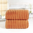 Elegant bath sheet with ribbed texture, stripe weave, and silky sheen border, ideal for wrapping or drying