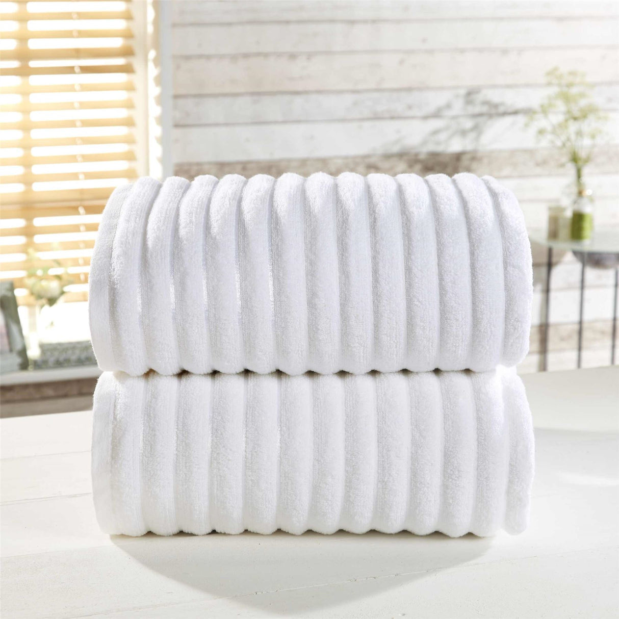 Deluxe face cloth measuring 30x30cm with plush ribbed texture and subtle stripe accents