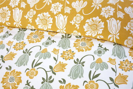 Vintage-inspired Victorian Bloom duvet set with vibrant pastel floral patterns in pink, yellow, and blue and a soft blue reverse for subtle elegance