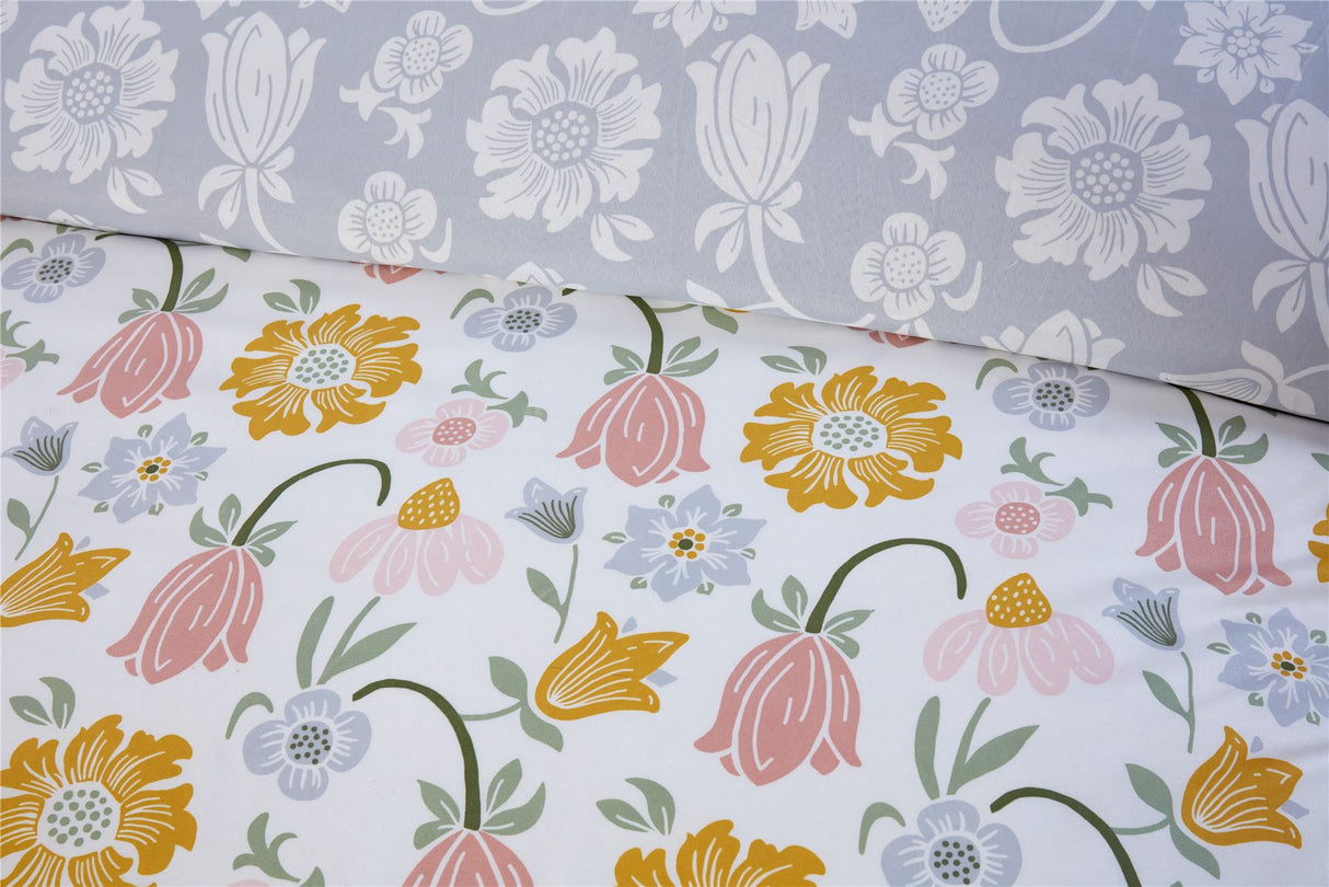 Vintage-style Victorian Bloom duvet set showcasing cheerful yellow and green floral motifs with a rich mustard reverse, adding warmth to your bedroom decor