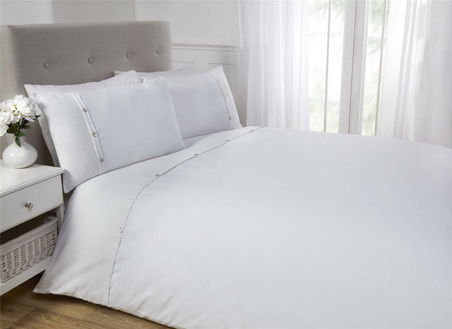 Luxurious 5th Avenue Duvet Set featuring a clean top cuff waffle design with pearl effect buttons for sophisticated bedroom décor