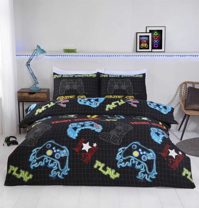 A vibrant gamer duvet set featuring a video game-themed design with matching pillowcases, designed for easy care, non-iron, fully reversible, with popper closures suitable for single and double bed sizes
