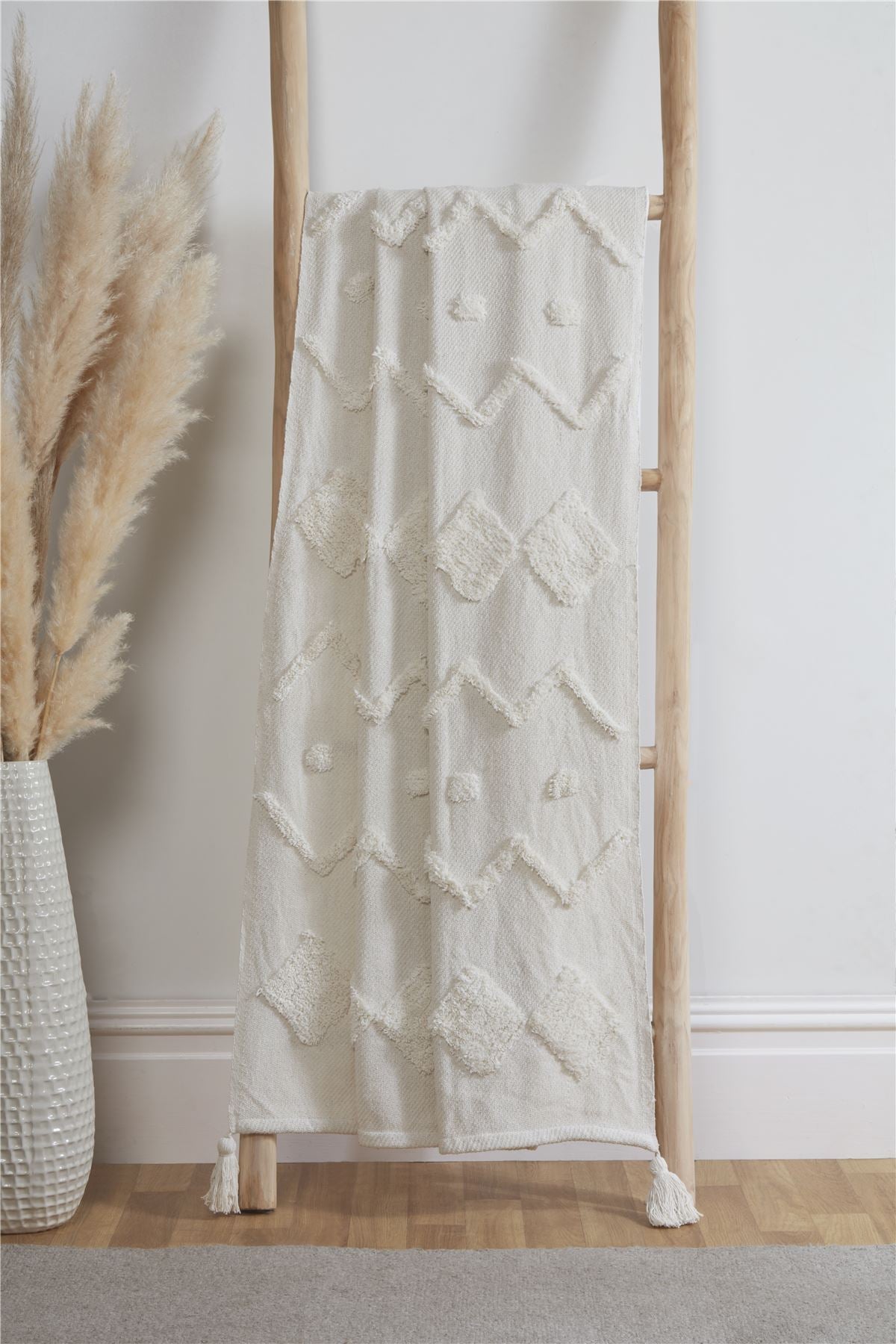 Soft and cozy Juniper Tufted Throw with tassels in ivory color