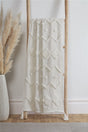 Soft and cozy Juniper Tufted Throw with tassels in ivory color