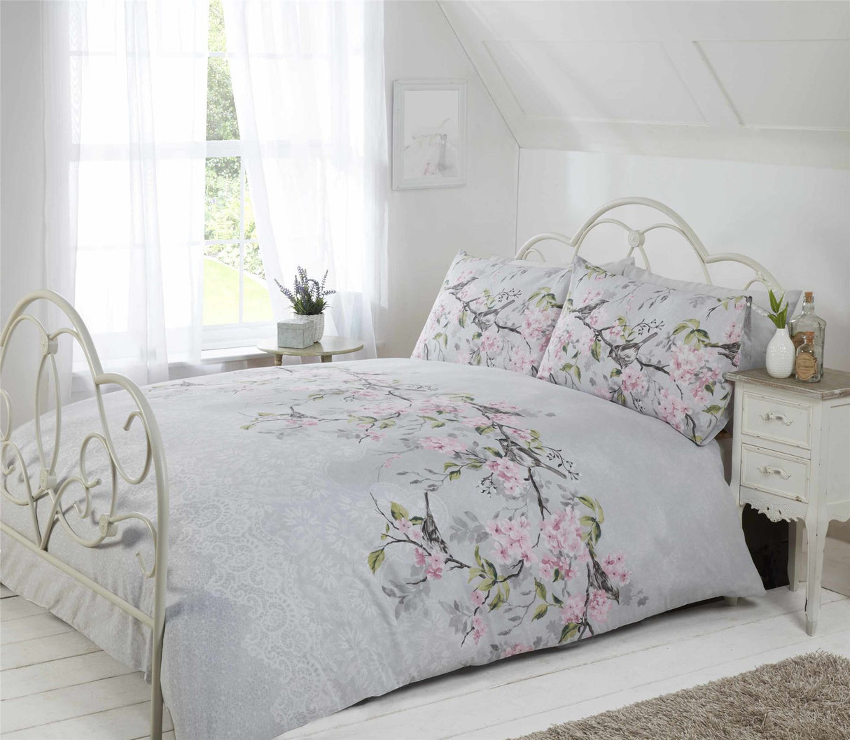 Spring and summer inspired Eloise Duvet Set featuring vibrant floral and bird design with feminine lace accents