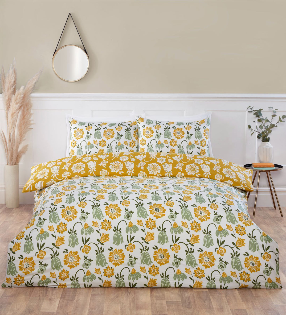 Victorian Bloom duvet set displaying vibrant floral patterns in pastel pink, yellow, and blue on a white background with a complementary soft blue reverse