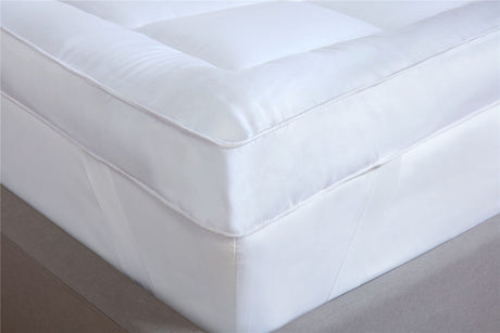 Elegant image showcasing a neatly made bed with a soft, high-quality luxury mattress topper to improve sleep experience