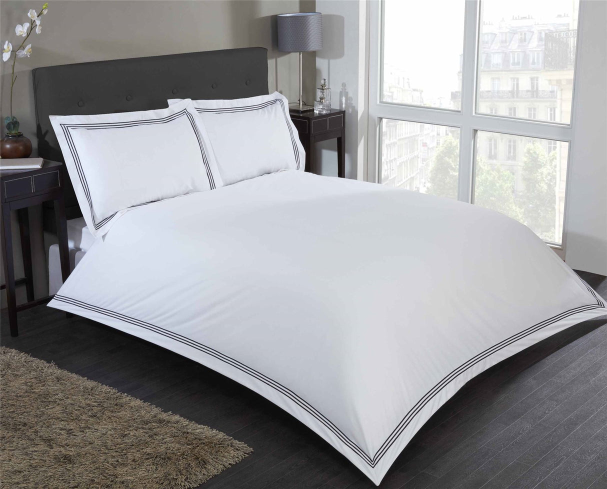 Contemporary Mayfair Duvet Set featuring minimalist design with embroidered rectangular border frame on duvet and pillowcases