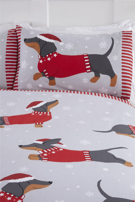 Holiday-themed bedding depicting a charming dachshund in Christmas clothing against a snowy backdrop on the duvet set