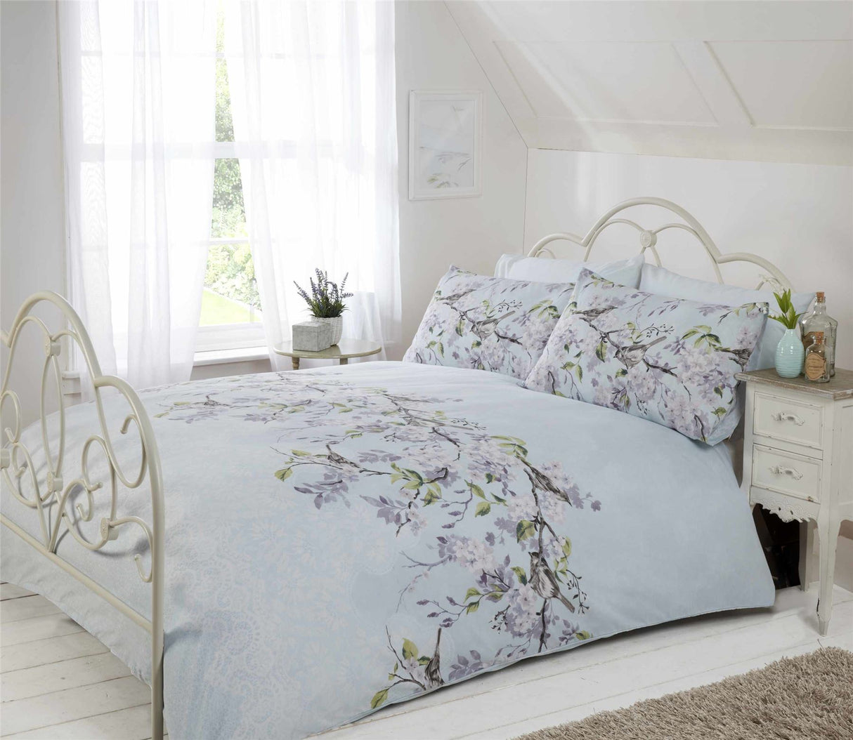 Enchanted floral blossom print duvet set with birds perched on flower branches and lace detail