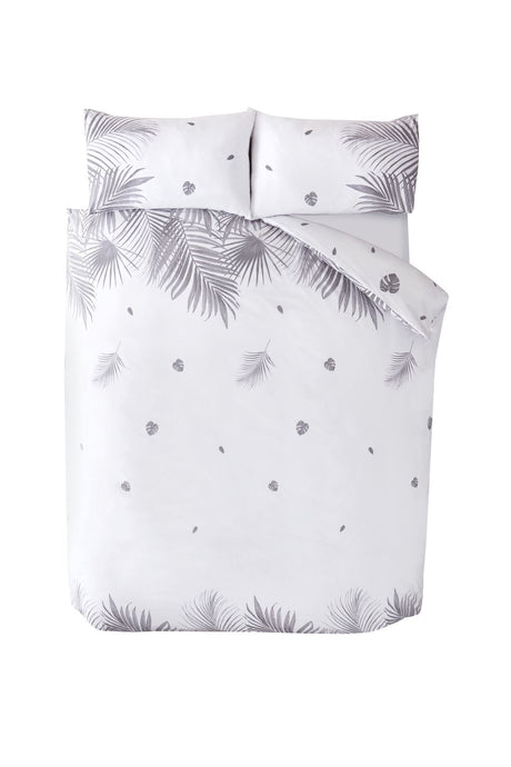 Single-sized duvet cover with tropical plant print, featuring a plastic-free packaging and popper closure