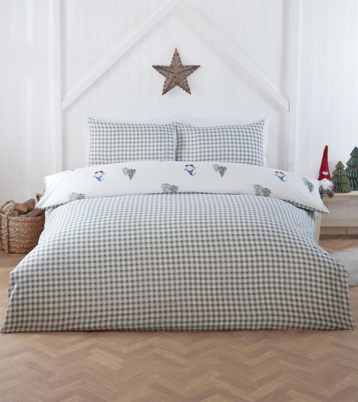 Reversible duvet cover with playful rotary design of gonks and Christmas trees on one side and classic gingham pattern on reverse