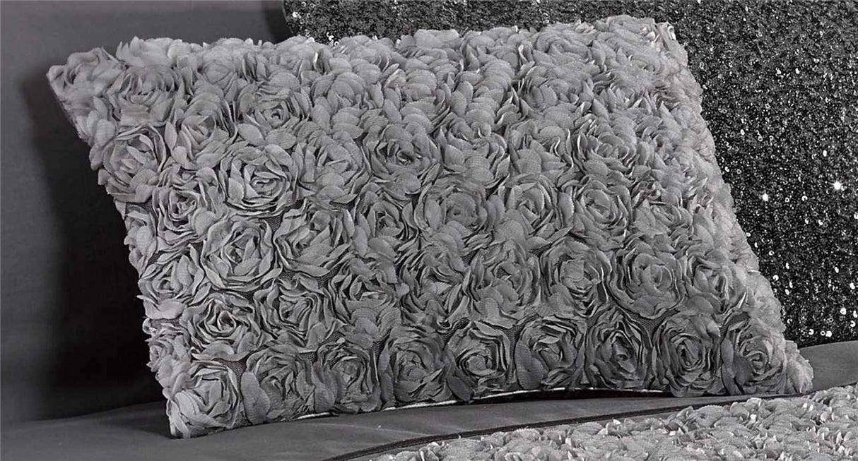 Close-up of the exquisite rose floral print on the Limoges boudoir cushion with elegant ruffle accents