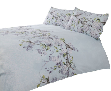 Eloise Duvet Cover Set showcasing colourful blossoms, bird illustrations, and intricate lace textures at the bottom