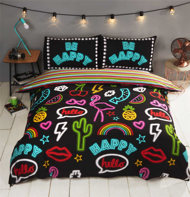 Bright colourful reversible duvet cover featuring trendy cactus, flamingo, and pineapple motifs with a neon print design and matching stripe reverse