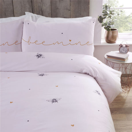 Close-up of the reversible bee mine duvet set showcasing bumblebees, love hearts, and matching blush pink pillowcases for a charming bedroom update