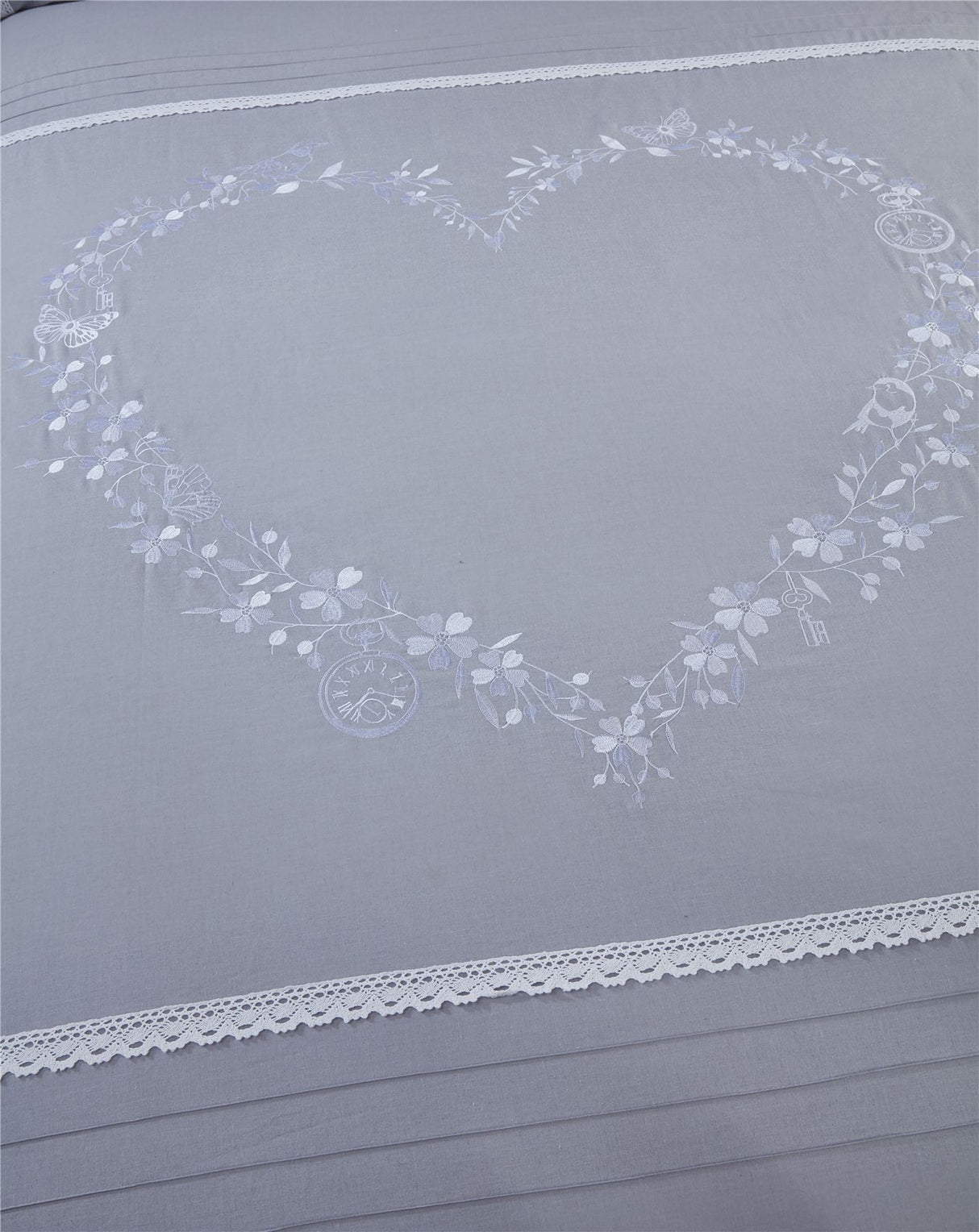 Superking bed set with embroidered hearts, crochet lace trimming, and detailed design elements
